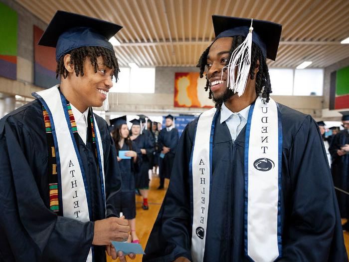 Two 宾州州立大学阿宾顿分校 student athletes celebrate their graduation